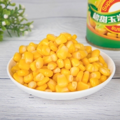 canned sweet corn with spoon & cover