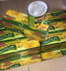 canned sweet corn with spoon & cover