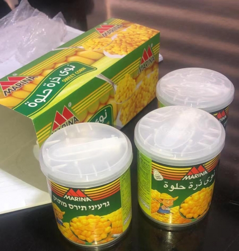 canned sweet corn with spoon & cover