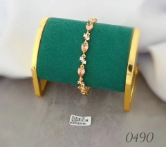 Gold bracelet with artificial gemstones