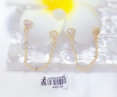 Gold heart-shaped earrings with chain