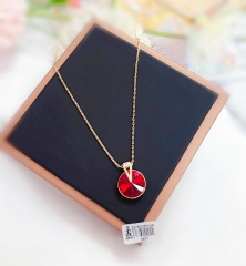 Gold-tone necklace with red zircon