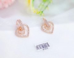 Hollow heart style earrings