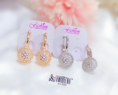 Hollow round white zircon earrings