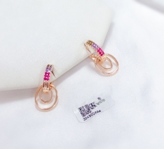 Hollow out, round colored zircon earrings