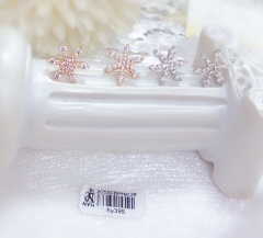 Sparkly earrings in snowflake shape