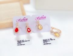 Gold-tone earrings with red/orange zircon