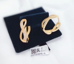 X-shaped golden earrings