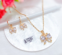 Butterfly style gold-tone earrings and necklace