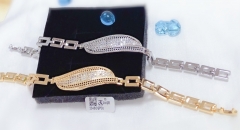 Gold bracelet with artificial gemstones