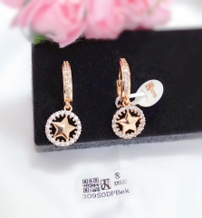 Gold-tone hollow star pendant earrings