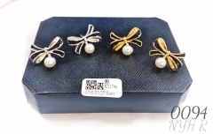 Black bow pearl earrings