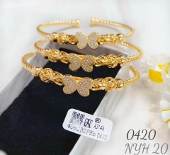 Butterfly style gold-tone bangle set