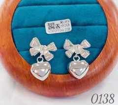 Gold bow heart whiter earrings