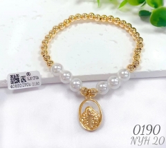 Irregular gold pendant pearl bangle