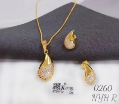 Half-polished half-zircon teardrop-shaped gold/silver earrings and necklace