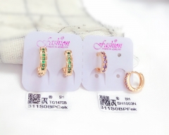 Green/purple zircon gold earring