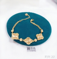 Four leaf clover style silver/gold bracelet