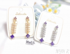 Purple fishbone style pendant earring