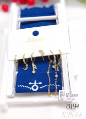 A collection of elegant zirconia earrings with musical symbols