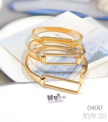 Three gold-plated bracelets