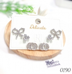Three pairs of bow stud earrings