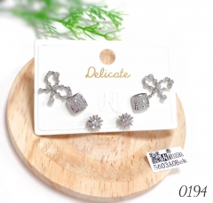 Bow snowflake zirconia stud earrings