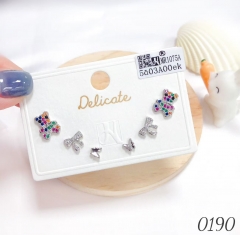 A three-piece set of colored zircon stud earrings by Little Bear