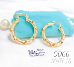 Large uniquely styled twisted gold-plated hoop earrings
