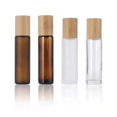 Venta caliente 5ml 10ml 15ml ámbar transparente esmerilado vidrio roll on botella con tapa de bambú