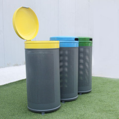 Outdoor metal trash bin with lid