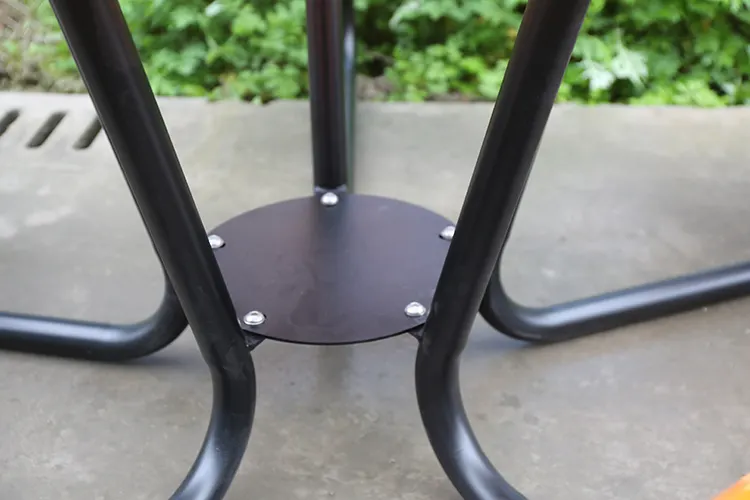 Round steel outdoor picnic table with chairs