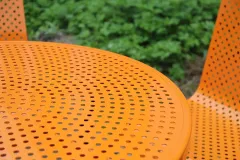 Round steel outdoor picnic table with chairs