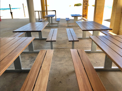 Outdoor picnic wood table with attached bench