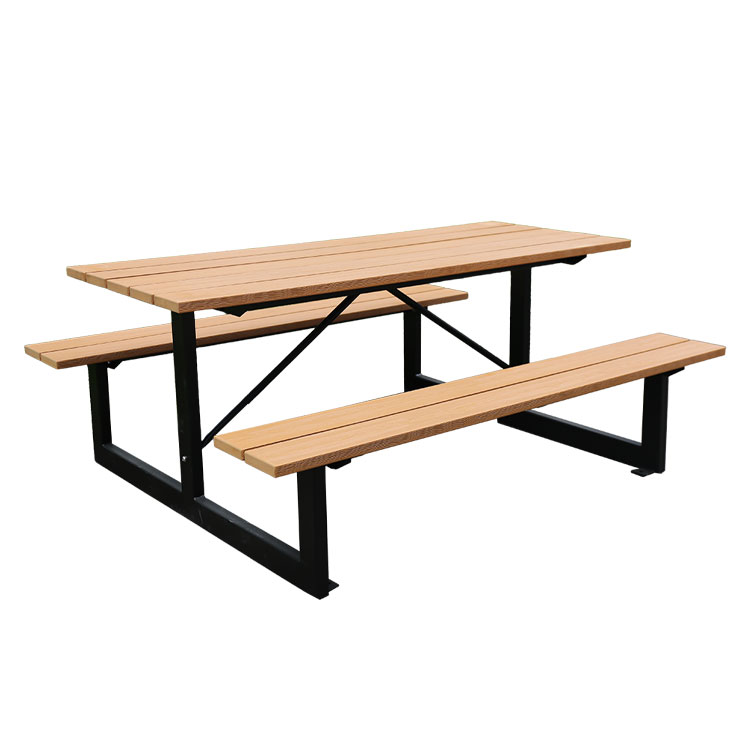 Outdoor picnic wood table with attached bench