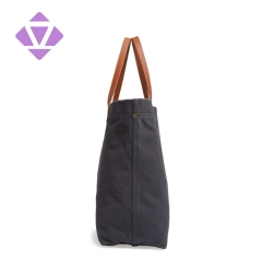 denim and luxury vegetable tanned leather tote bag