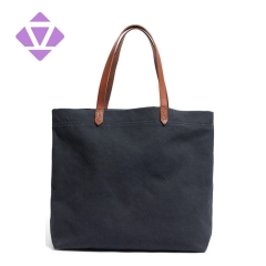 denim and luxury vegetable tanned leather tote bag