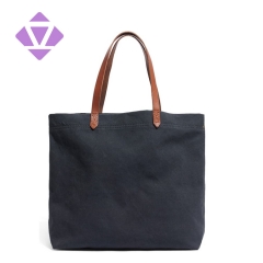 denim and luxury vegetable tanned leather tote bag