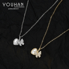 قلادة نسائية مطلية ذهب تصميم شكل فراشة وقلب مزينة بالزاركون وصدف