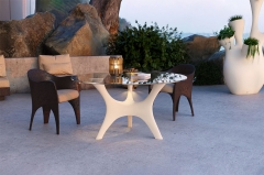 Sleek Sculptural Dining Table with Fiberglass Frame and Glass Top for Modern Decor