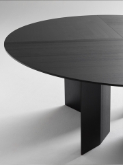 Minimalist Round Dining Table with Angular Wood Supports for Modern Interiors