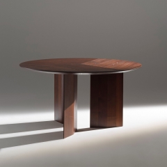 Minimalist Round Dining Table with Angular Wood Supports for Modern Interiors