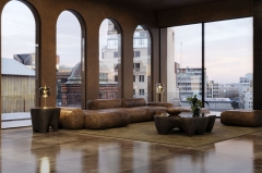 Modern Organic-Shaped Coffee Table with Volcanic Rock Finish and Fiberglass Base for Luxury Living Spaces