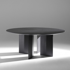 Minimalist Round Dining Table with Angular Wood Supports for Modern Interiors