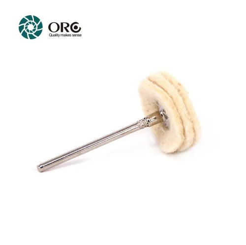 Small layered cotton cloth buffing wheel for high-luster finishing on jewelry and metal.