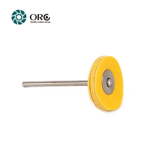 Yellow leather circular buffing disc mounted on a rotary tool shank for professional finishing.