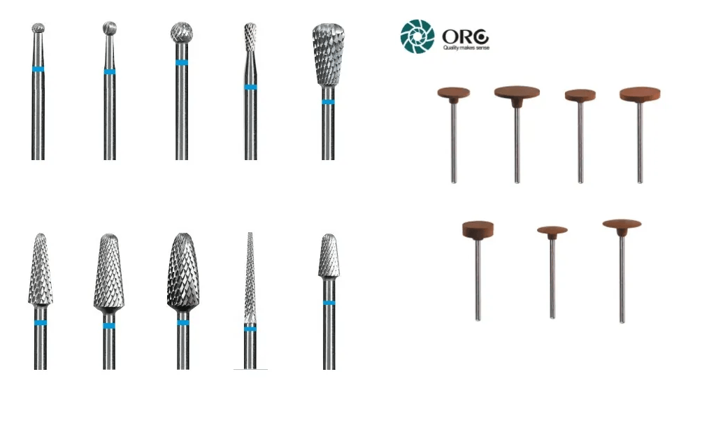 Assorted dental tungsten carbide burs and brown silicone rubber polishing wheels for acrylic.