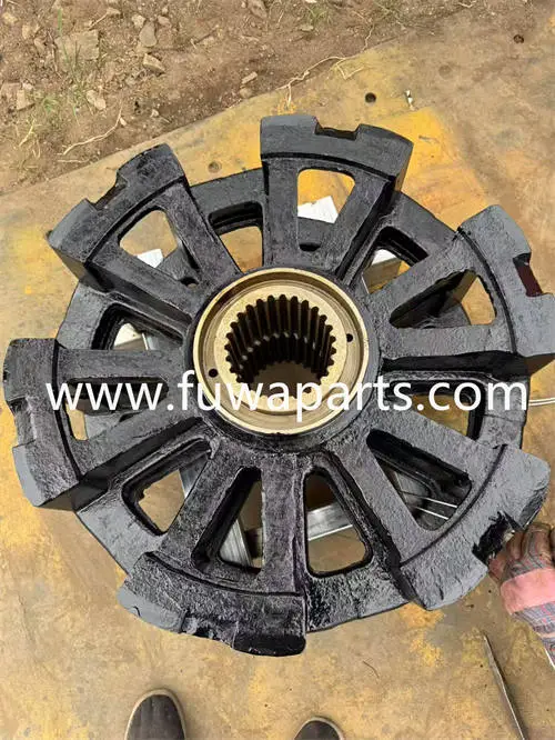 Circular black cast-metal part with radial arms and splined center.