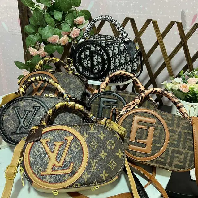Oval-shaped Ladies Hand Bag