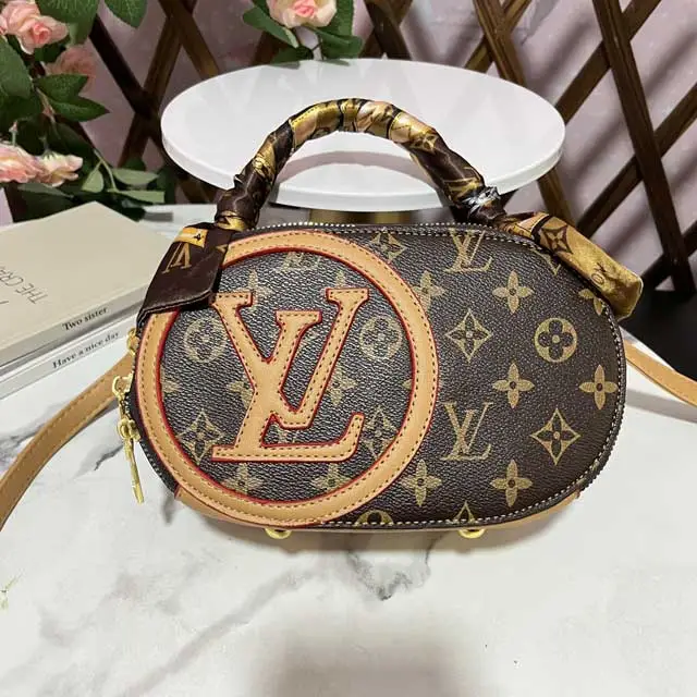 Oval-shaped Ladies Hand Bag